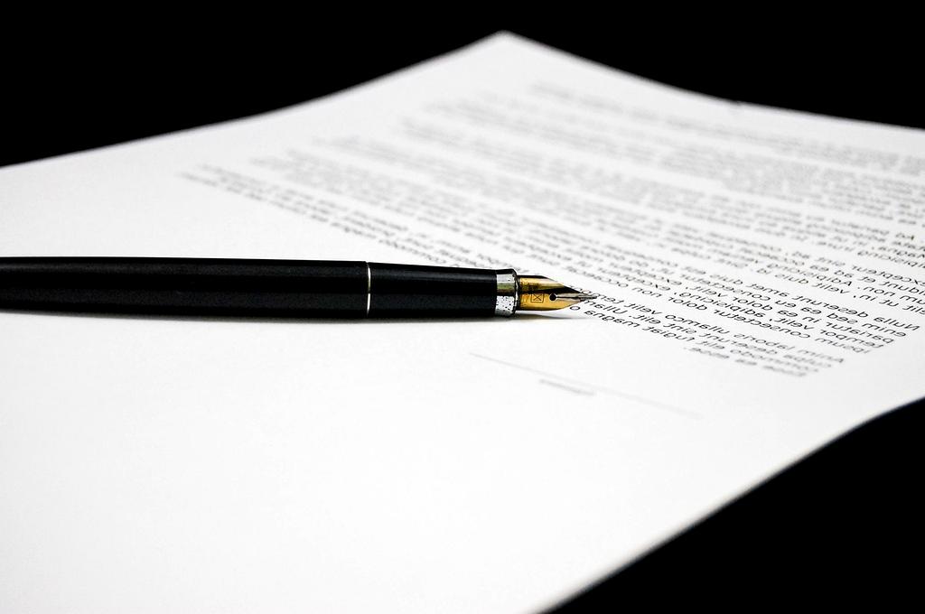 Financial consultant reviewing budget documents on a desk